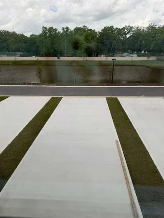 a view of a swimming pool with an outdoor seating