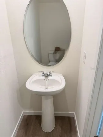 a bathroom with a sink and mirror