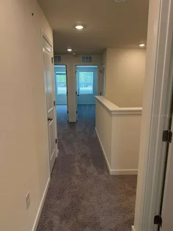 a view of hallway with stairs