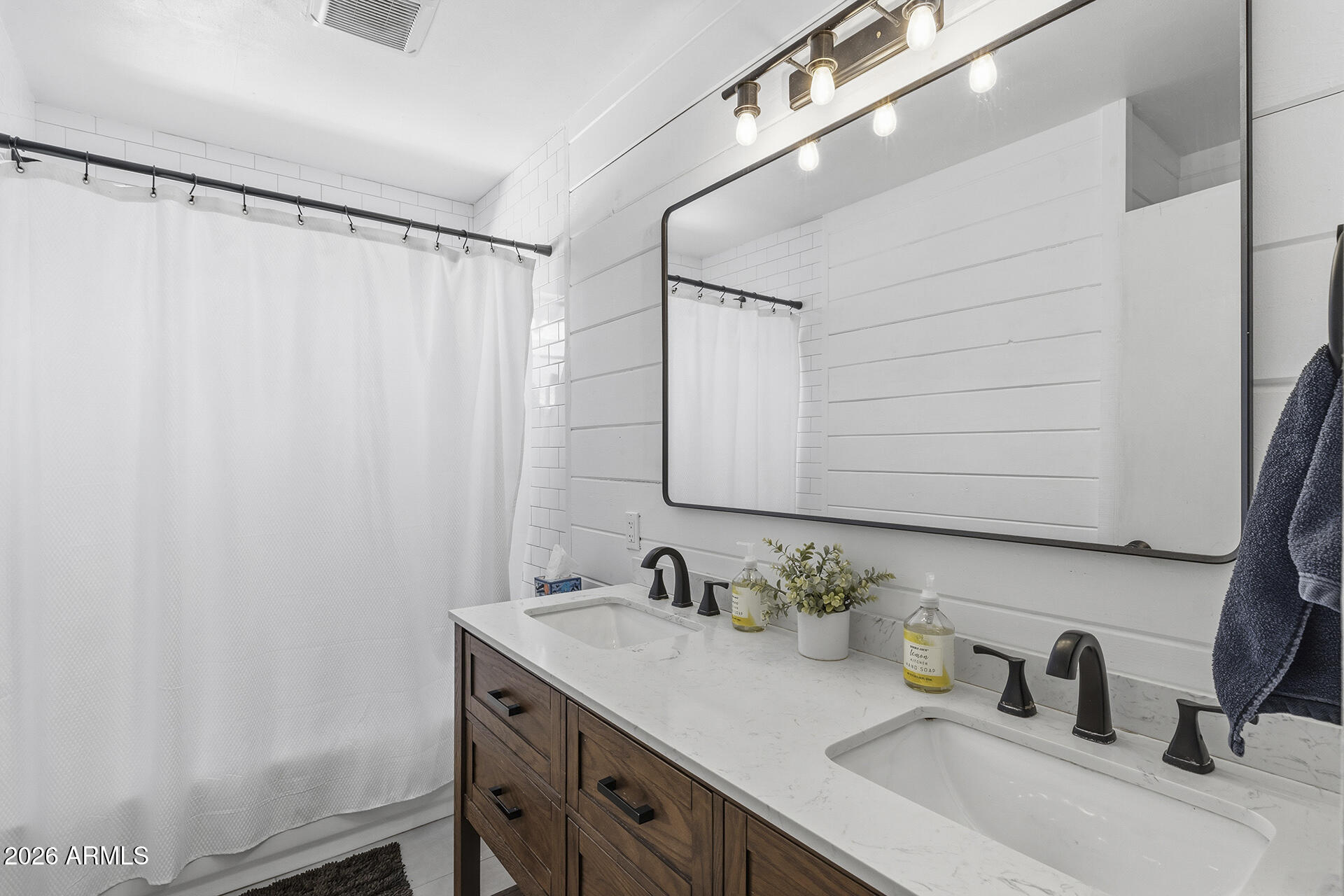 5228 North 15th Street Phoenix, AZ 85014 - Photo 42 of 96 a bathroom with a sink and a mirror