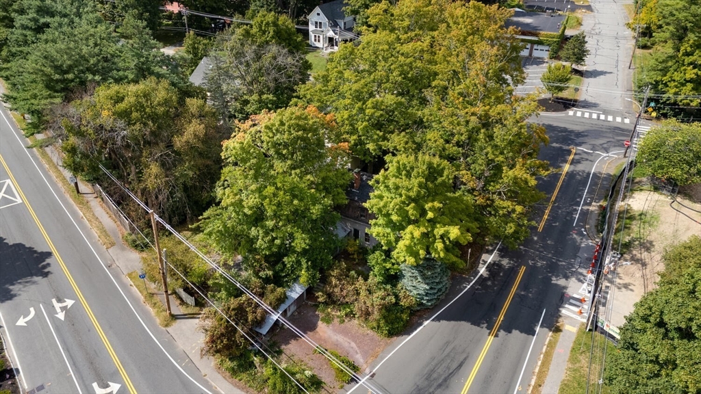 15 Crescent Street Stow, MA 01775 - Photo 19 of 21 a view of a yard with plants and wooden fence