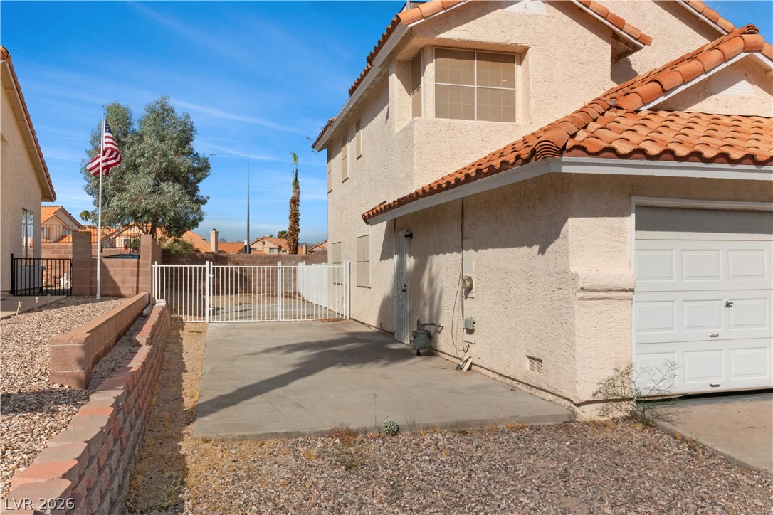 3156 Terrace View Drive Laughlin, NV 89029 - Photo 55 of 94 Mediterranean-inspired stucco exterior with a tiled roof and an attached garage.