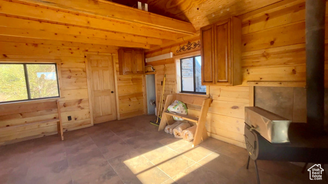 Undisclosed Address Summit, UT 84772 - Photo 15 of 24 Miscellaneous room featuring tile patterned flooring, wood walls, and beam ceiling
