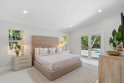 a bedroom with a large bed and a couch
