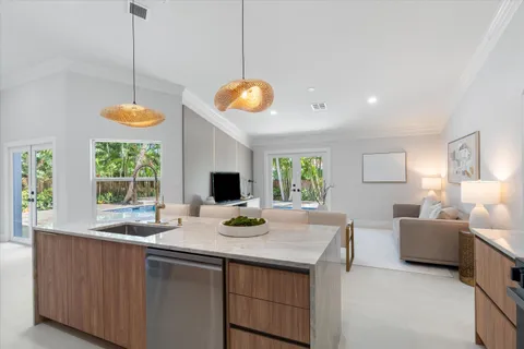 a kitchen with a sink appliances and a counter top space