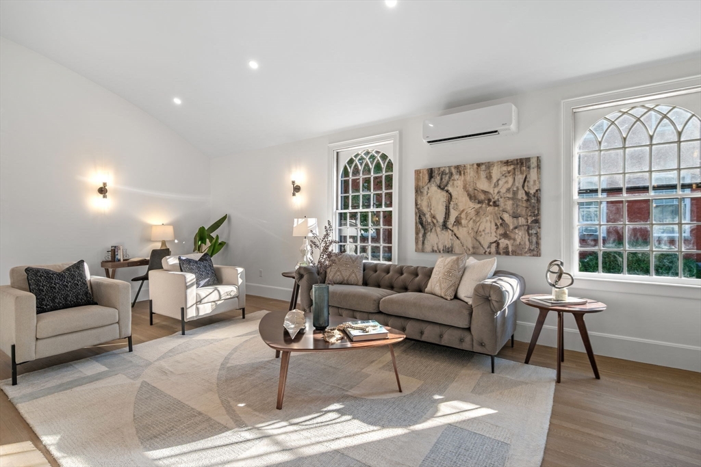 134 Elm Street, Unit 134 Marblehead, MA 01945 - Photo 11 of 38 a living room with furniture and a large window