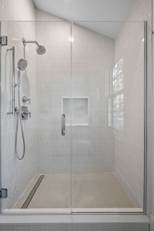 134 Elm Street, Unit 134 Marblehead, MA 01945 - Photo 17 of 38 a bathroom with a glass shower door