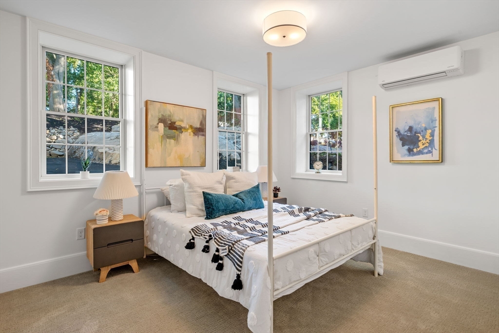 134 Elm Street, Unit 134 Marblehead, MA 01945 - Photo 20 of 38 a bedroom with a bed and a window