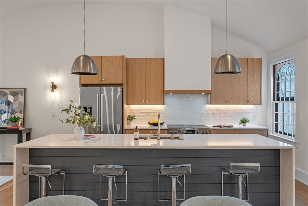 134 Elm Street, Unit 134 Marblehead, MA 01945 - Photo 4 of 38 a kitchen with a sink cabinets and window