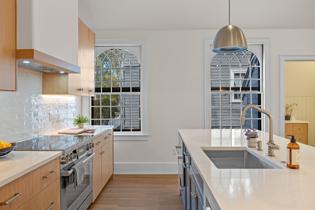 134 Elm Street, Unit 134 Marblehead, MA 01945 - Photo 5 of 38 a kitchen that has a sink and a stove