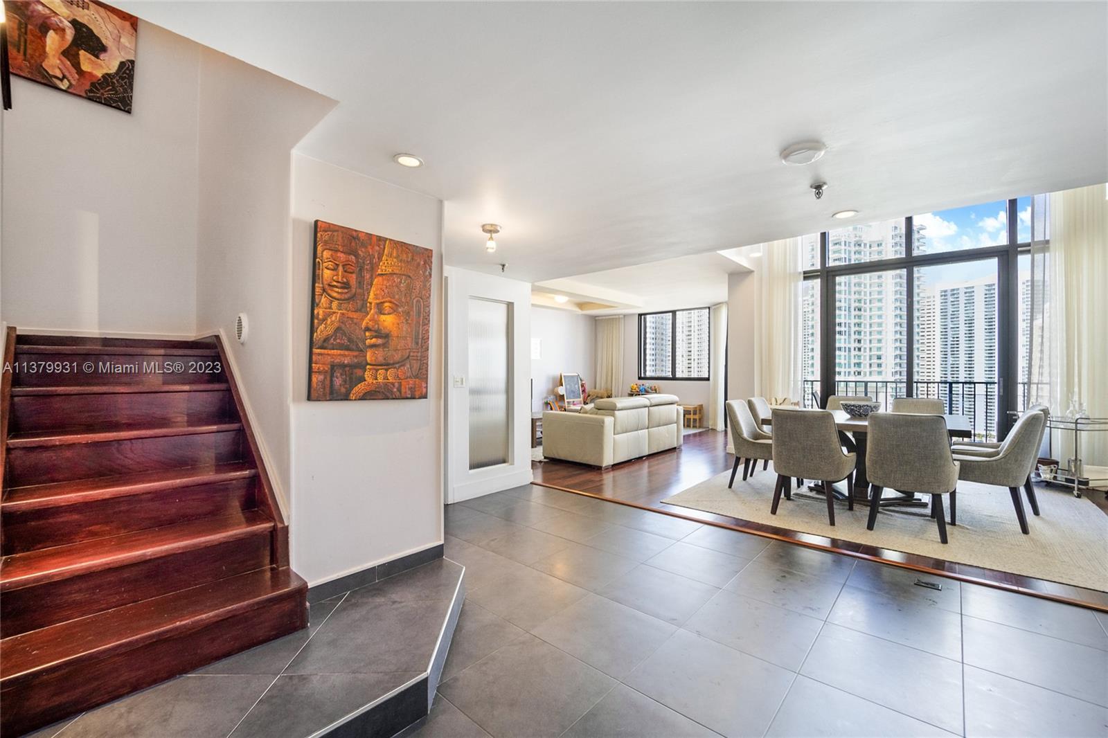 520 Brickell Key Drive, Unit APH10 Miami, FL 33131 - Photo 1 of 23 a living room with furniture and wooden floor