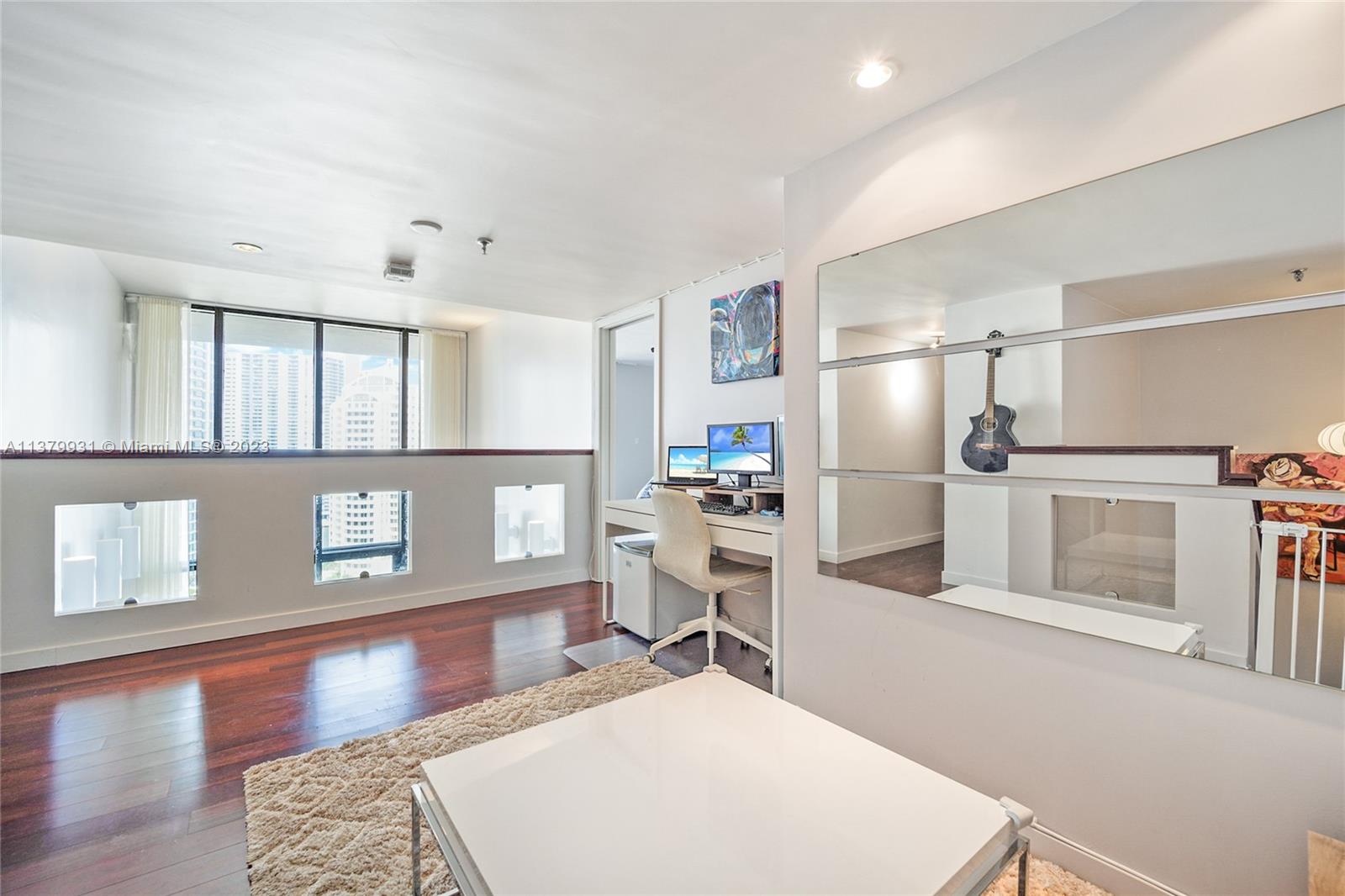 520 Brickell Key Drive, Unit APH10 Miami, FL 33131 - Photo 12 of 23 a kitchen with stainless steel appliances kitchen island sink refrigerator and stove