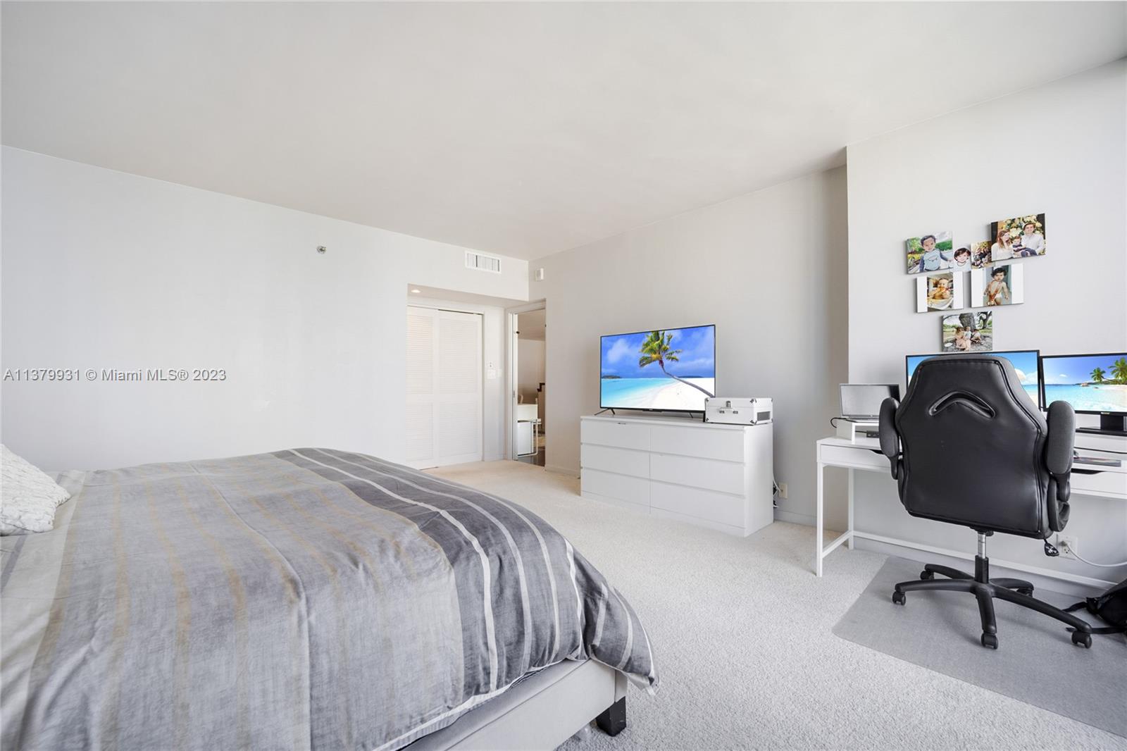 520 Brickell Key Drive, Unit APH10 Miami, FL 33131 - Photo 16 of 23 a bedroom with a bed chair and dresser