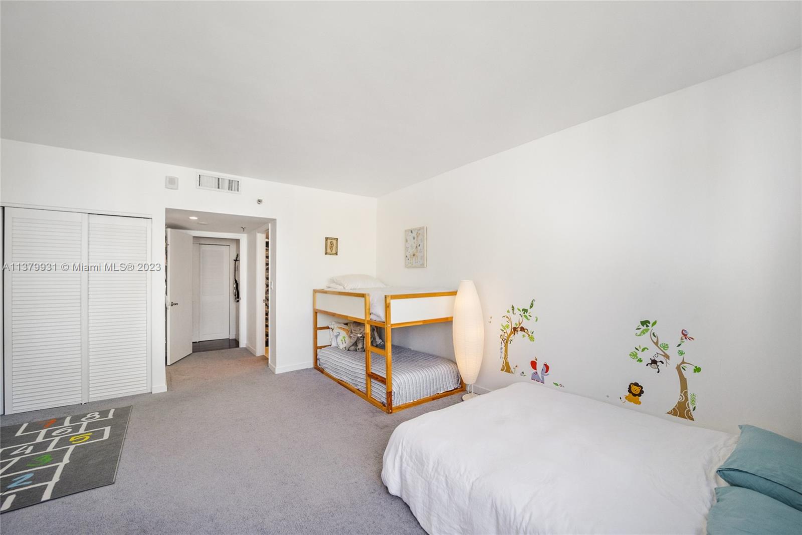 520 Brickell Key Drive, Unit APH10 Miami, FL 33131 - Photo 19 of 23 a bedroom with furniture and a potted plant