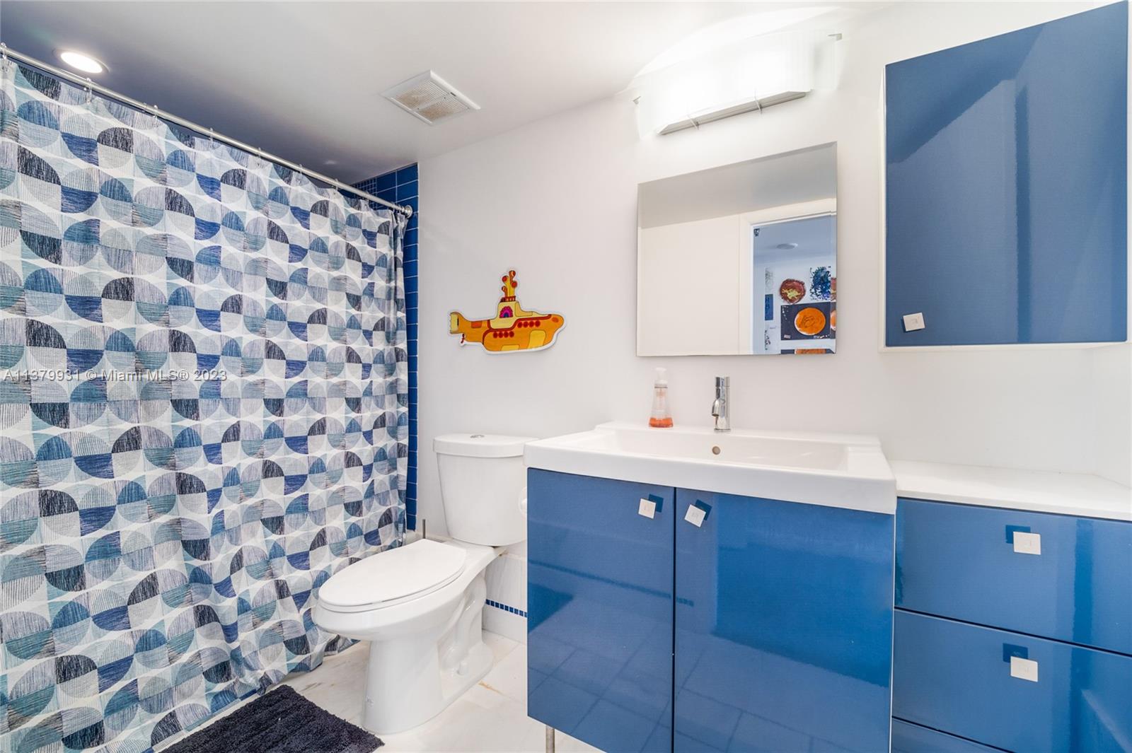 520 Brickell Key Drive, Unit APH10 Miami, FL 33131 - Photo 21 of 23 a bathroom with a sink toilet and shower