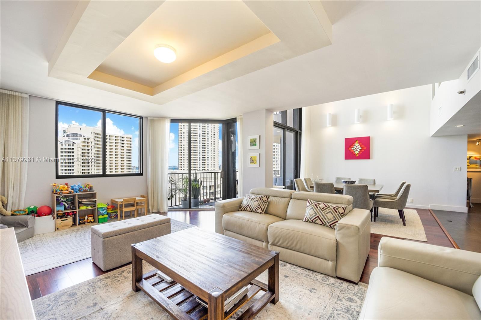 520 Brickell Key Drive, Unit APH10 Miami, FL 33131 - Photo 4 of 23 a living room with furniture and a large window