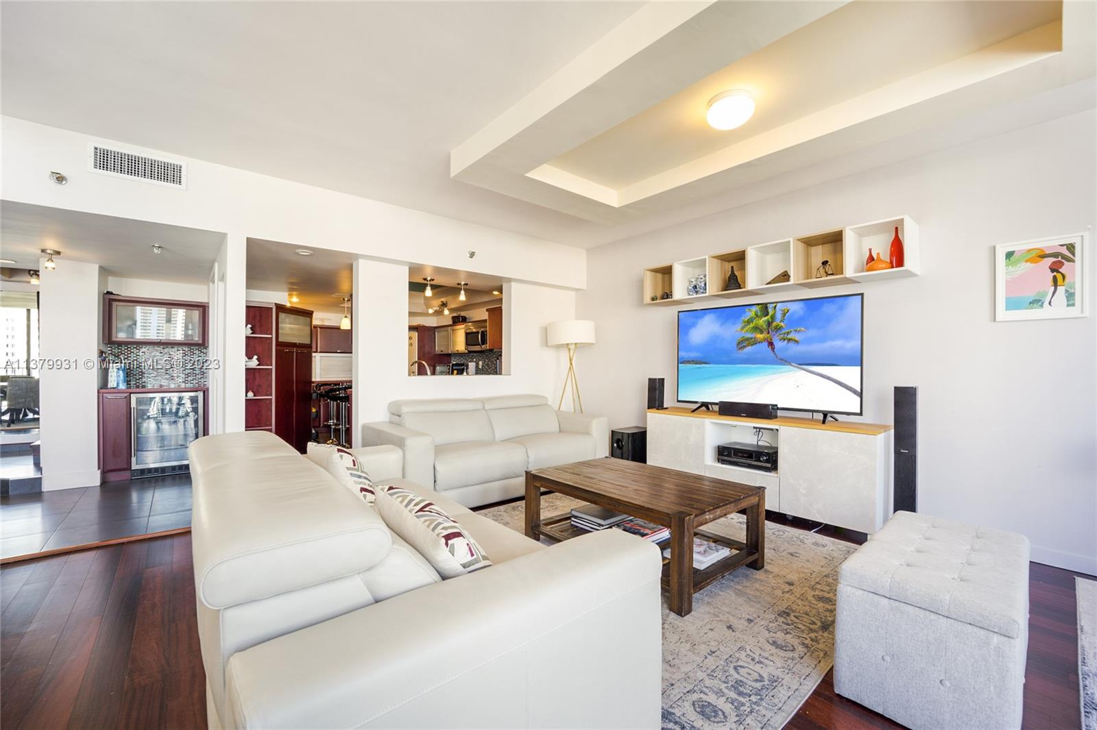 520 Brickell Key Drive, Unit APH10 Miami, FL 33131 - Photo 5 of 23 a living room with furniture and wooden floor
