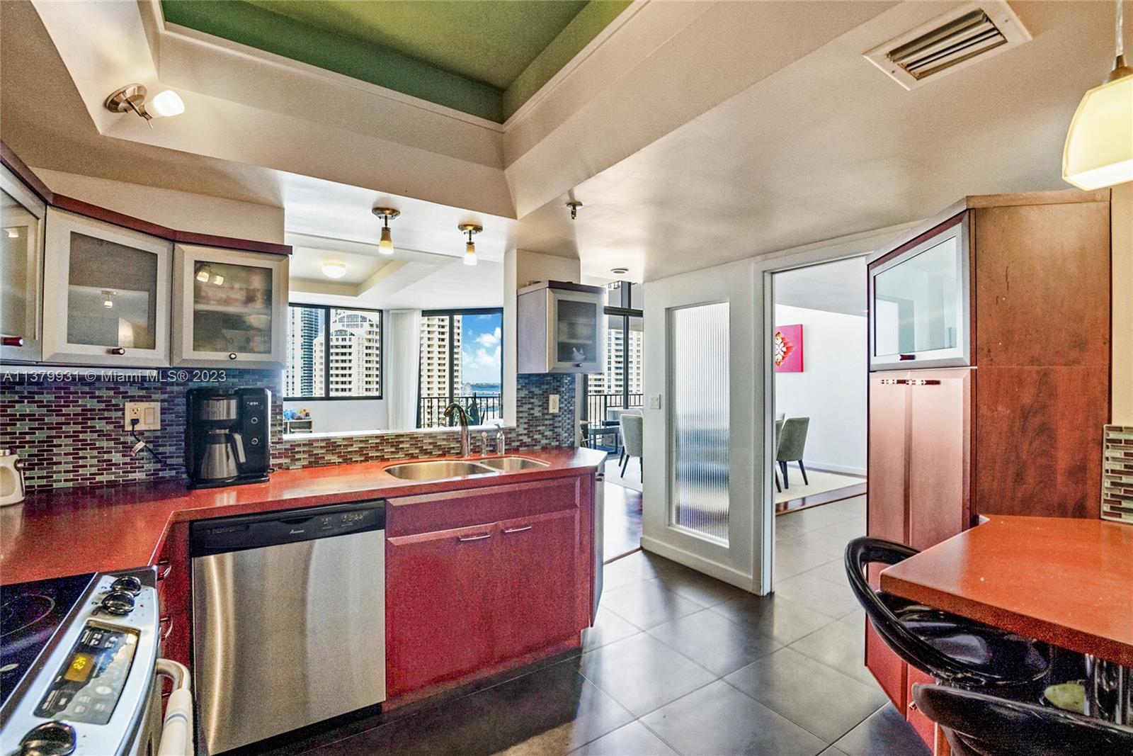 520 Brickell Key Drive, Unit APH10 Miami, FL 33131 - Photo 7 of 23 a room with furniture and a window
