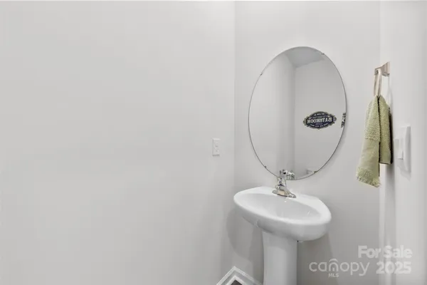 a bathroom with a sink and mirror