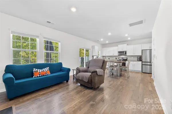 a living room with furniture and a large window