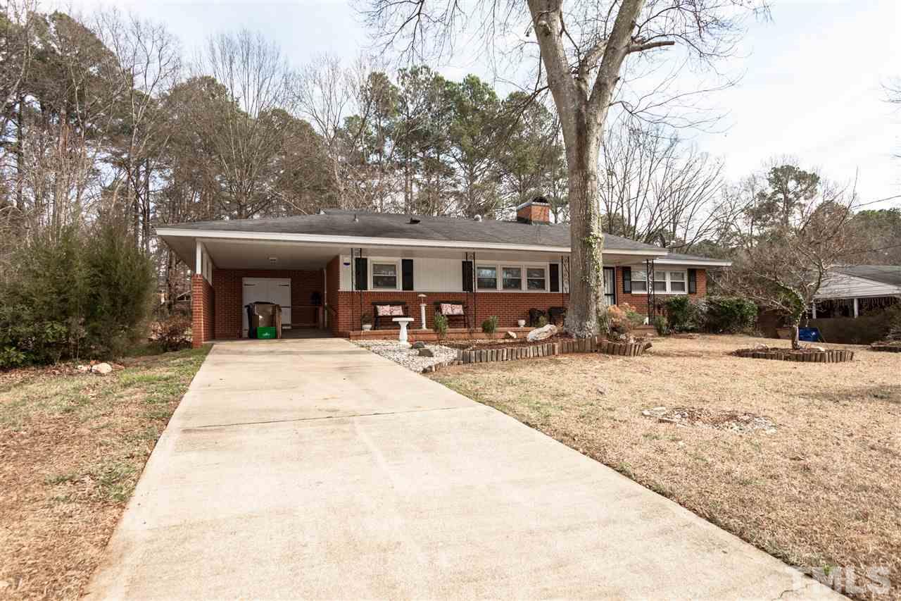 1421 Ashburton Road Raleigh, NC 27606 - Photo 3 of 24 a view of a house with snow on the road