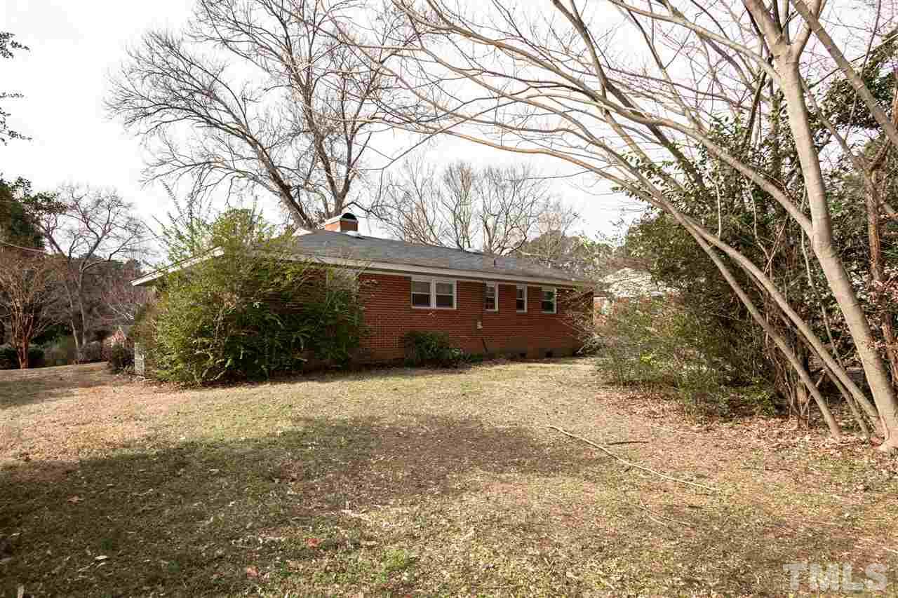 1421 Ashburton Road Raleigh, NC 27606 - Photo 22 of 24 a front view of a house with a yard