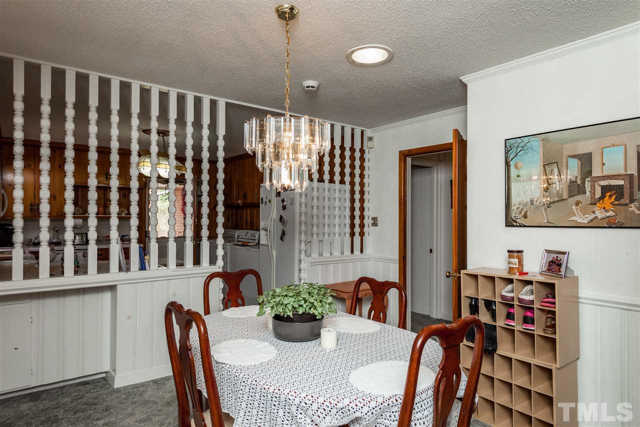 1421 Ashburton Road Raleigh, NC 27606 - Photo 8 of 24 a dining room with furniture and window