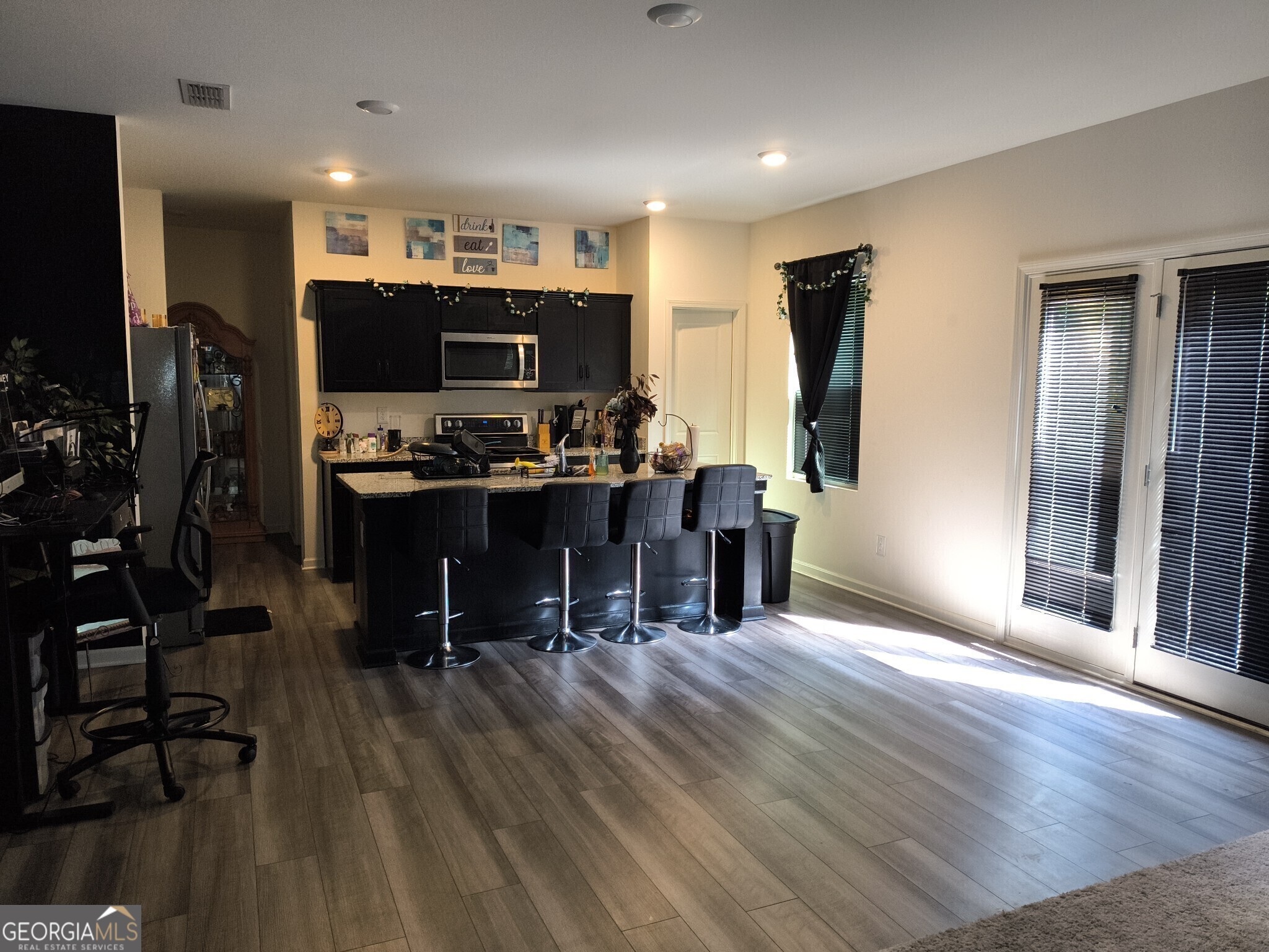 99 Cooperton Lane Villa Rica, GA 30180 - Photo 3 of 4 a view of a workspace with furniture and wooden floor