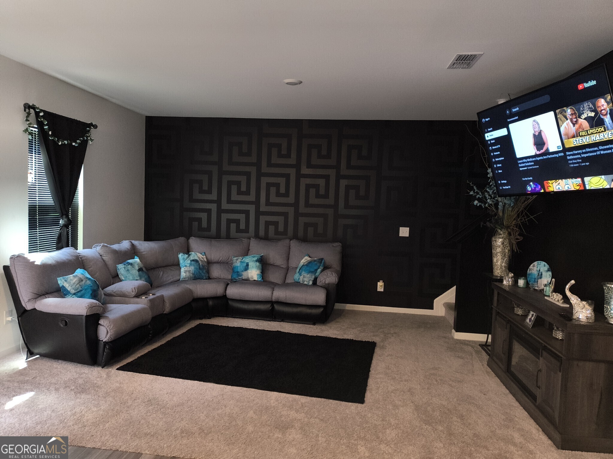 99 Cooperton Lane Villa Rica, GA 30180 - Photo 4 of 4 a living room with furniture and a flat screen tv