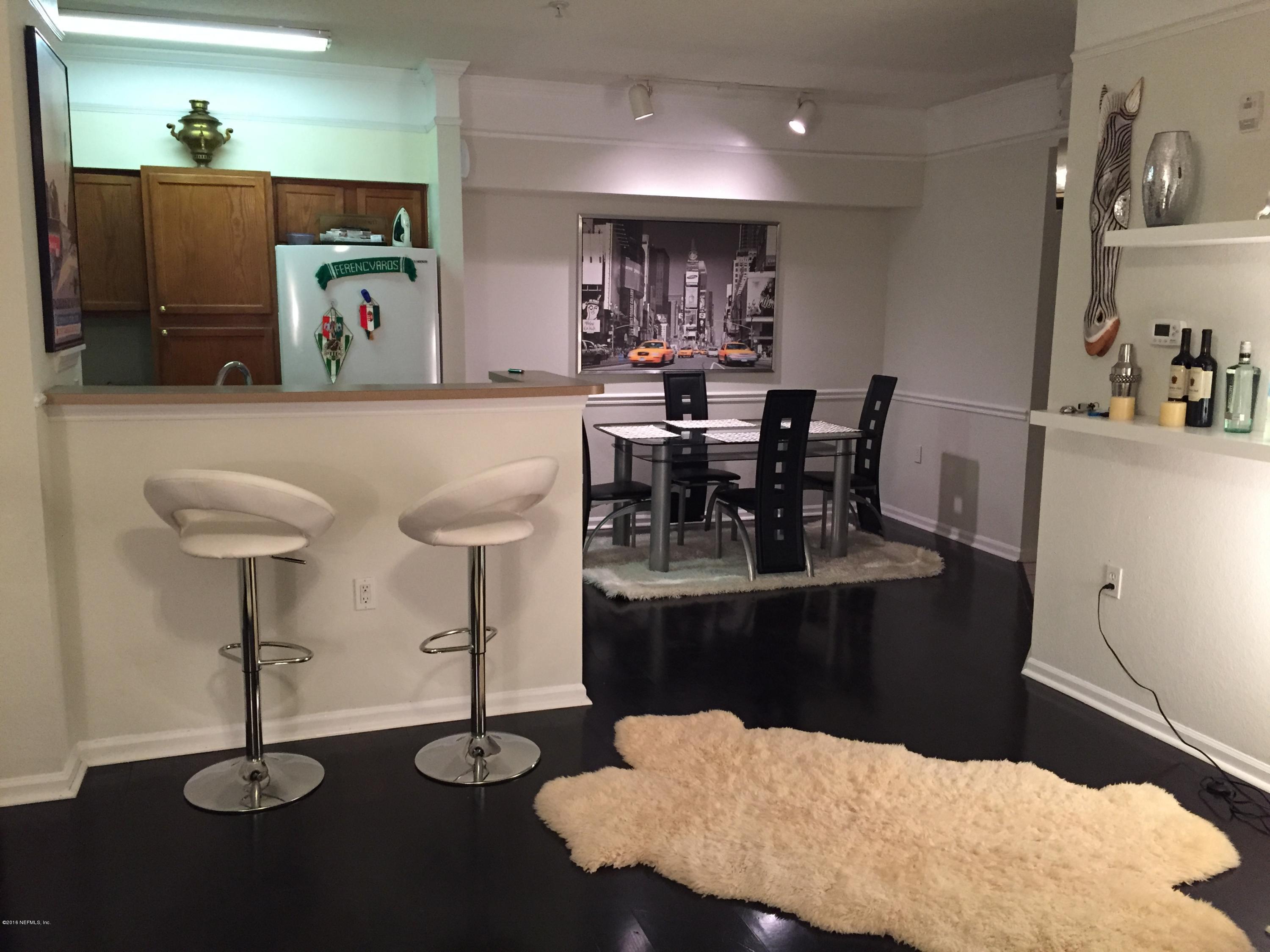 8550 Touchton Road, Unit 118 Jacksonville, FL 32216 - Photo 2 of 10 a view of a dining room with furniture