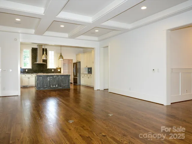 a view of a kitchen with a sink and a large window