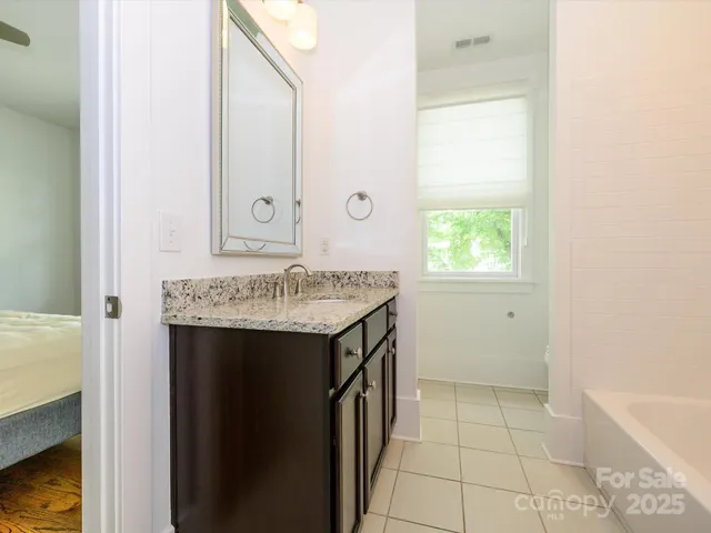 a view of bathroom with dual sinks