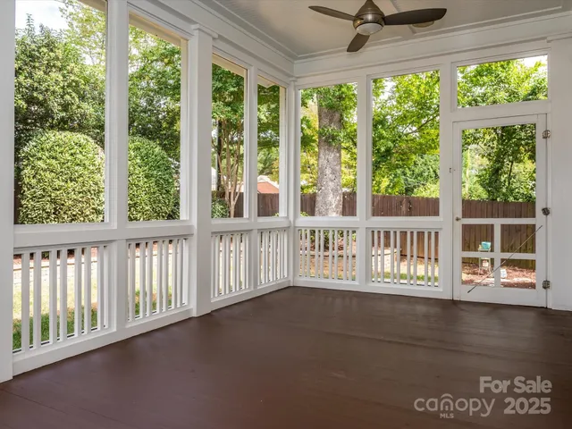 a view of a porch with a floor to ceiling window