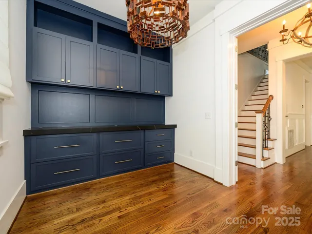 a room with a dresser and a window