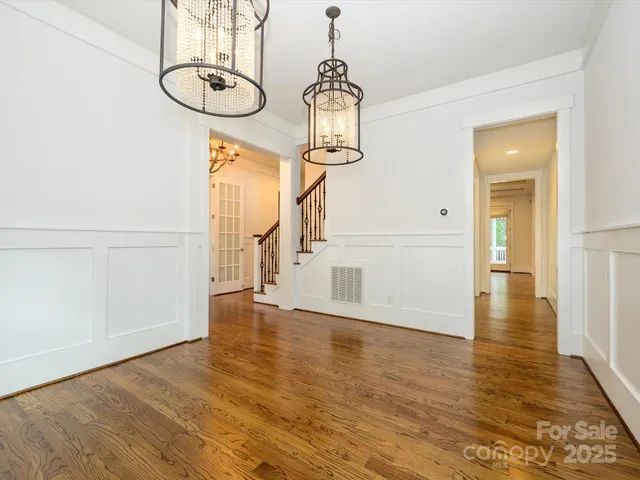 a view of an entryway with wooden floor