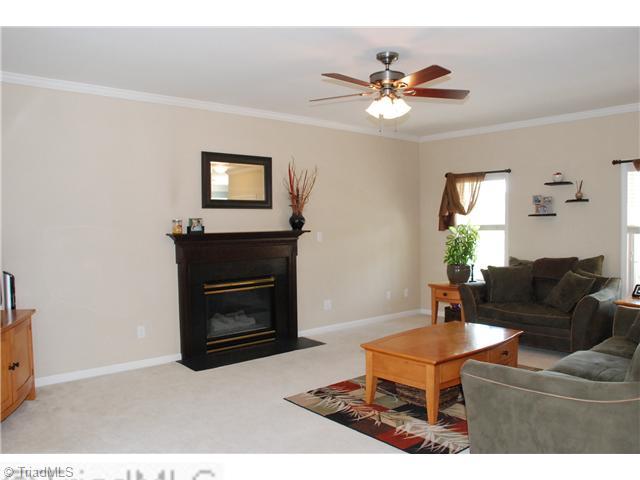 3707 Pointer Court High Point, NC 27265 - Photo 2 of 15 Den/Family/Great Room. Huge great room with crown molding and ceiling fan lighting. The gas-log fireplace is the focal point of the room.