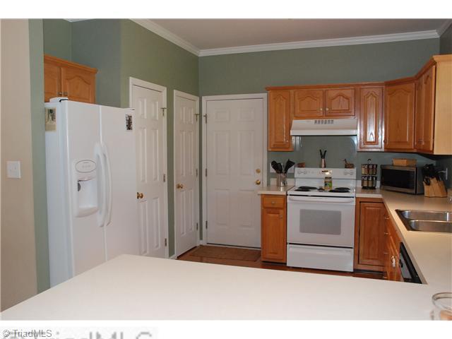 3707 Pointer Court High Point, NC 27265 - Photo 5 of 15 Kitchen. With easy access to the garage, unloading groceries is a breeze. You will find a coat closet and pantry just inside the garage door.