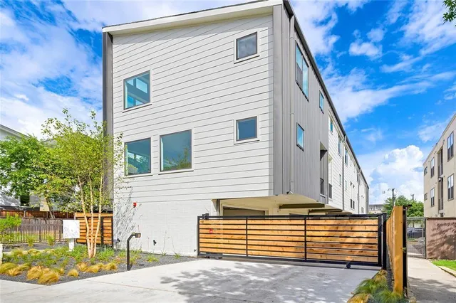 a view of a house with a small yard