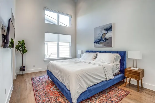 a bedroom with bed and a window