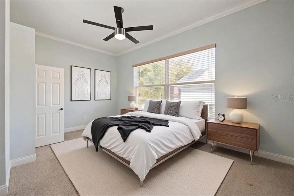 12150 Mapleridge Drive Parrish, FL 34219 - Photo 11 of 45 a bedroom with a bed and window