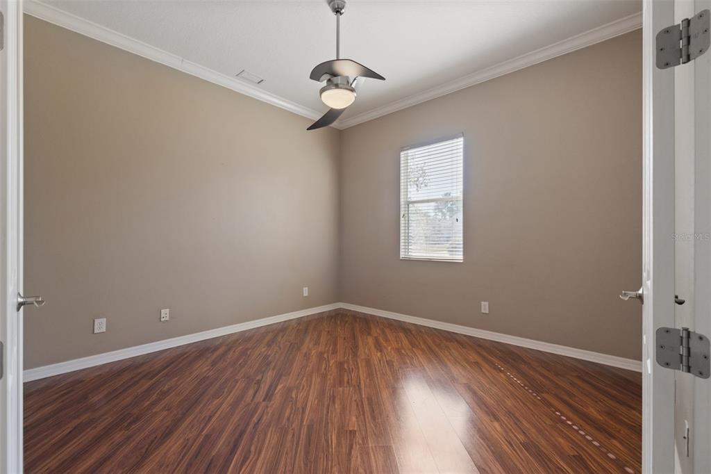 12150 Mapleridge Drive Parrish, FL 34219 - Photo 14 of 45 wooden floor in an empty room with a window