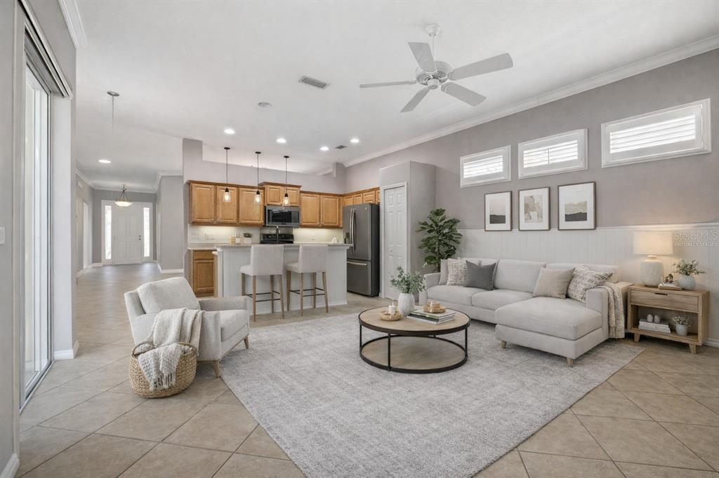 12150 Mapleridge Drive Parrish, FL 34219 - Photo 15 of 45 a living room with furniture and kitchen view