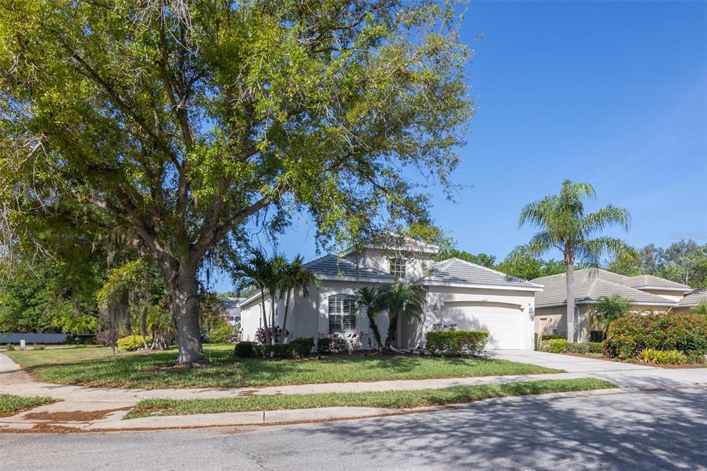 12150 Mapleridge Drive Parrish, FL 34219 - Photo 2 of 45 a view of a house with a yard and potted plants