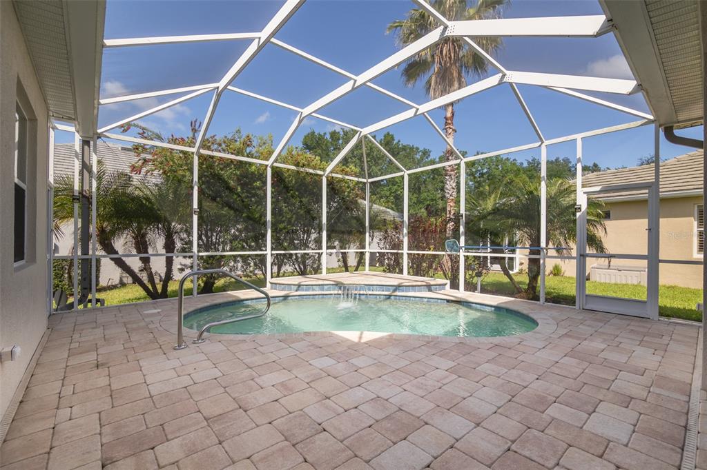 12150 Mapleridge Drive Parrish, FL 34219 - Photo 21 of 45 a view of a backyard with swimming pool and sitting area