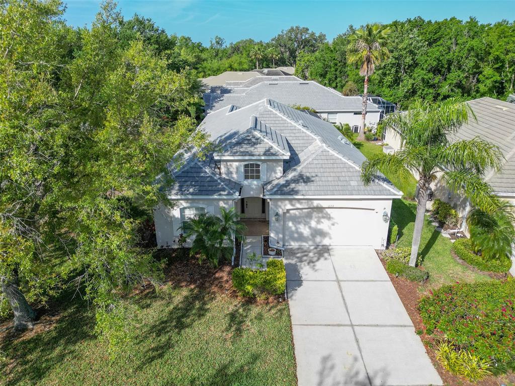 12150 Mapleridge Drive Parrish, FL 34219 - Photo 23 of 45 a aerial view of a house with a yard and large trees
