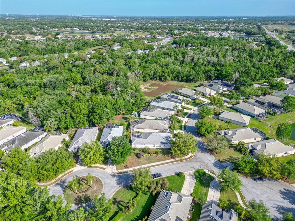 12150 Mapleridge Drive Parrish, FL 34219 - Photo 32 of 45 an aerial view of residential houses with outdoor space