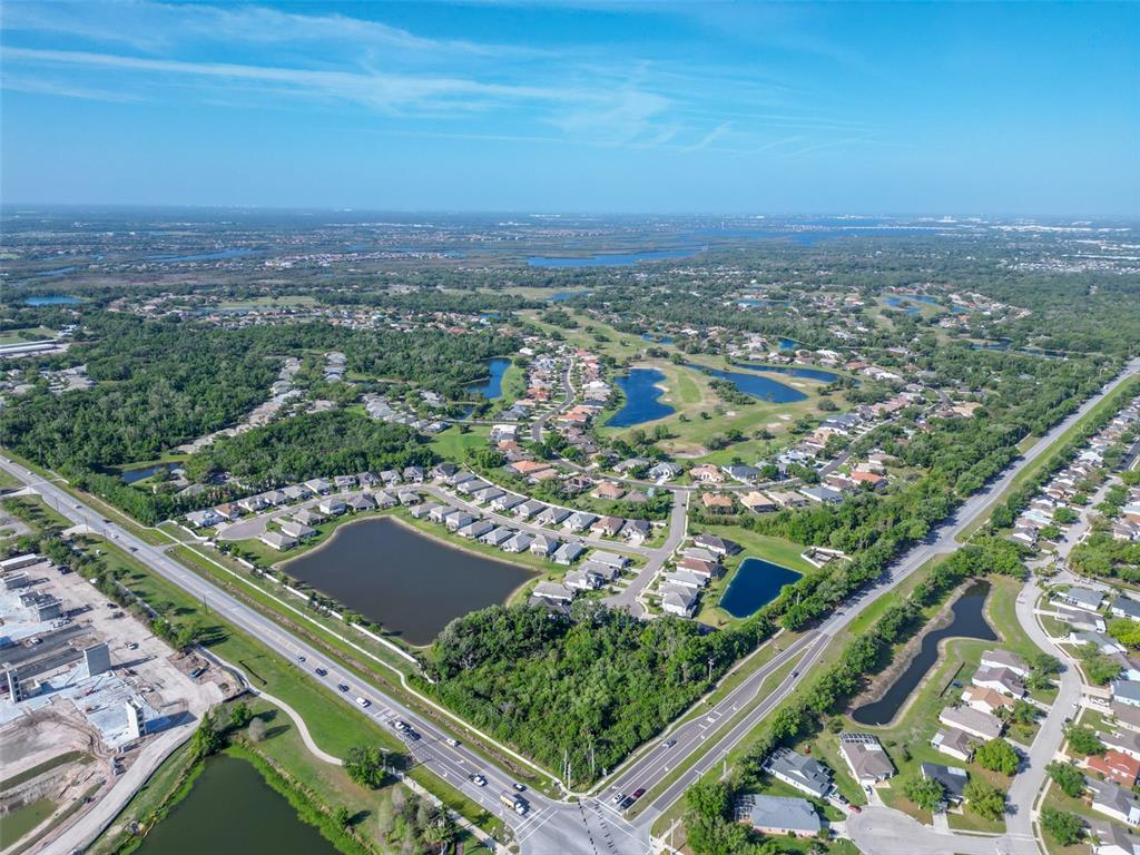 12150 Mapleridge Drive Parrish, FL 34219 - Photo 38 of 45 an aerial view of residential houses with outdoor space