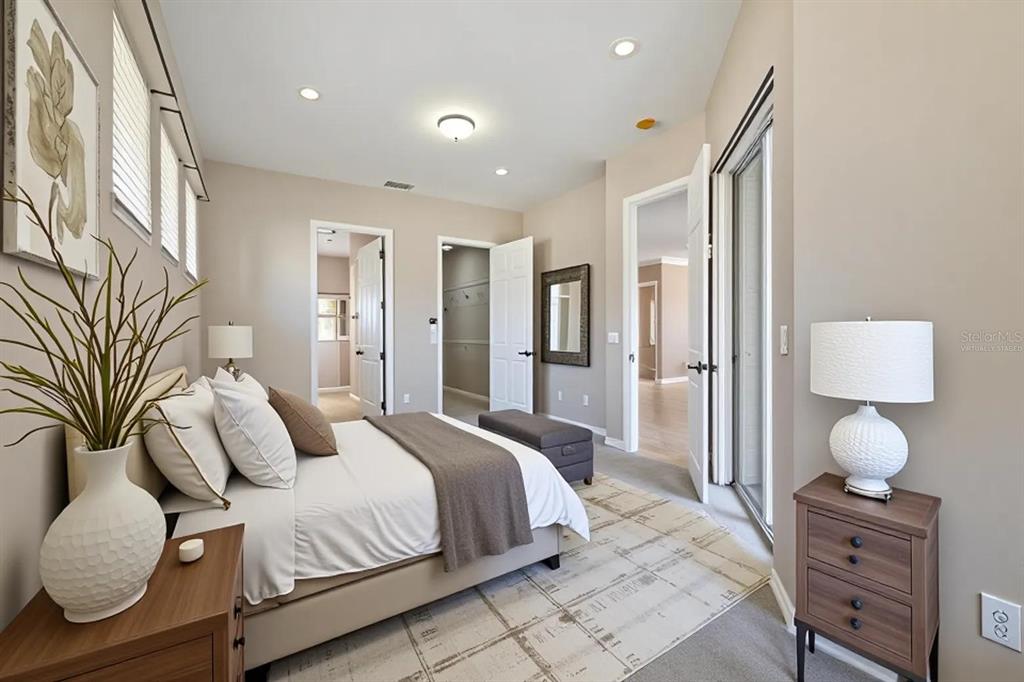 12150 Mapleridge Drive Parrish, FL 34219 - Photo 9 of 45 a bedroom with a bed and cabinets