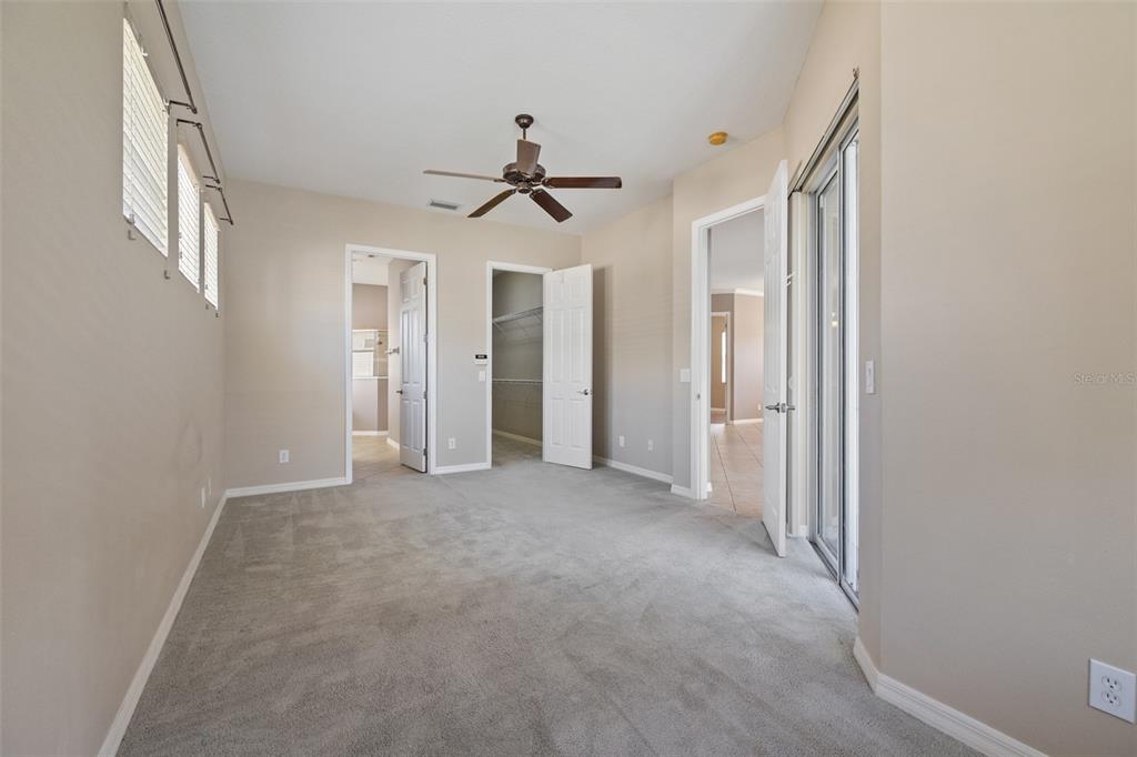 12150 Mapleridge Drive Parrish, FL 34219 - Photo 10 of 45 a view of a big room with chandelier fan and windows