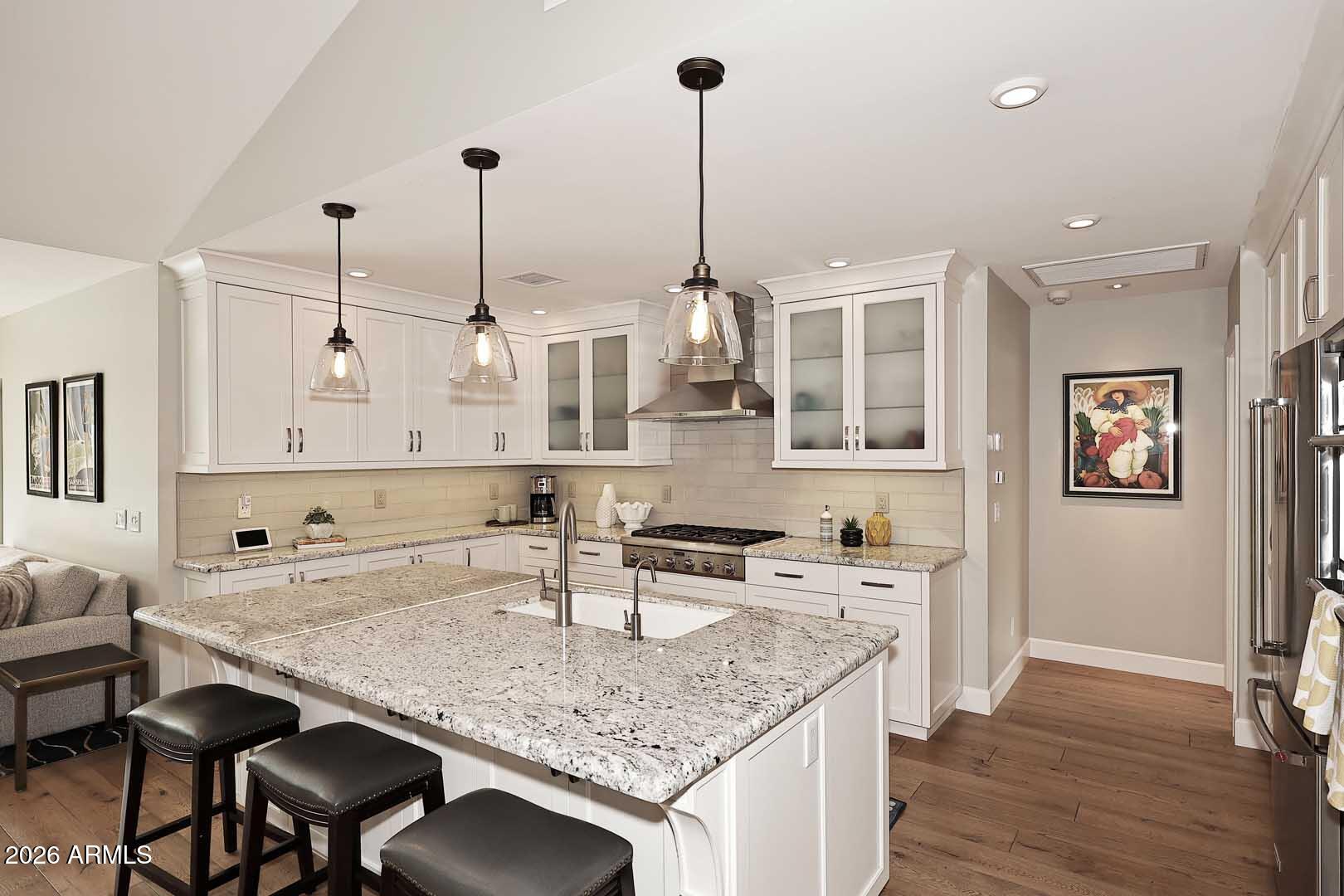 2525 East Pierson Street Phoenix, AZ 85016 - Photo 13 of 36 a kitchen with sink cabinets and wooden floor